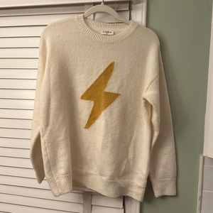 Storia cream and gold “lightning bolt” sweater. Size small, fits a little big.